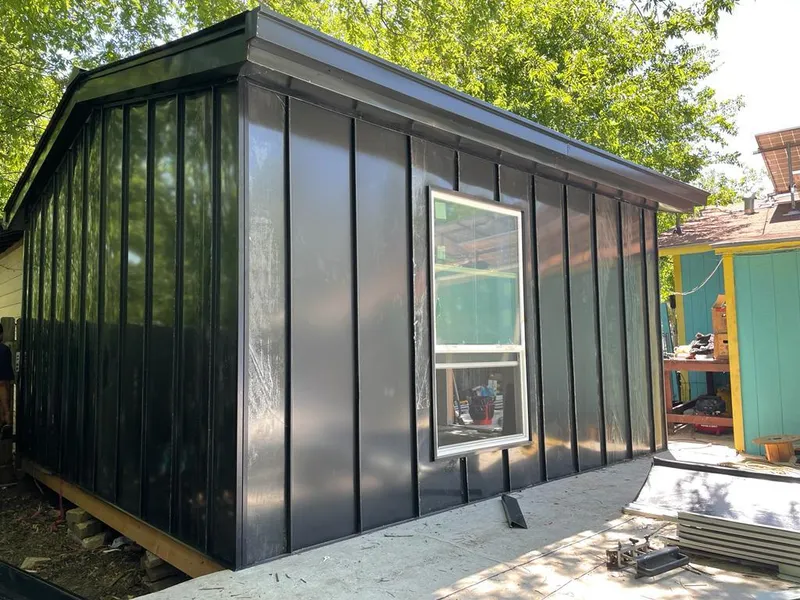 Black standing seam metal wall panels for Roof Inspection in Farmersville