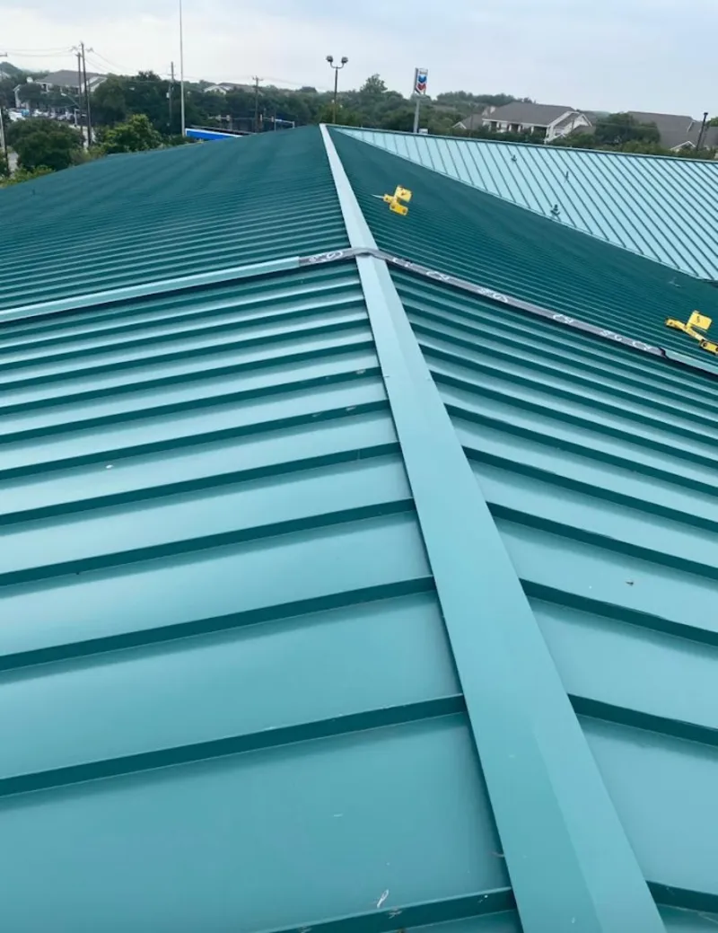 Green commercial metal roof ridge and valley for Metal Roof Repair in Farmersville